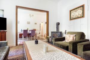 a living room with a couch and a fireplace at Grosszügiges Ferienhaus mit Wald in Gerdau