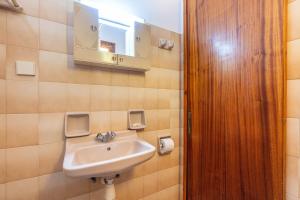 a bathroom with a sink and a mirror at Mires House Side Ground Floor 3 in Agios Gordios +20 photos