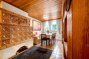 a dining room with a table and a couch at Am Fischertor in Bad Kreuznach