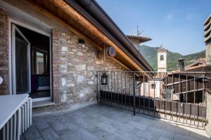 a balcony with a view of a building at Appartamento Gufo in Tremosine Sul Garda