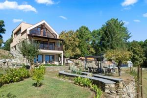 a house with a view of a yard at Terra Nossa com Piscina aquecida in Vila Real