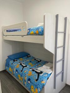two bunk beds in a room with a bed at Il Paradiso Holiday in Ravenna