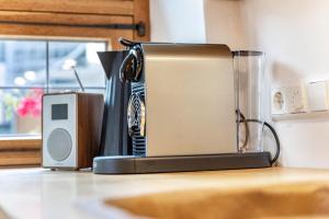 a toaster sitting on a counter next to a blender at Apartment Zwiefirst in Grafing