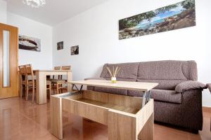 a living room with a couch and a table at Casa Rosi 1 in Puerto del Rosario