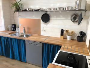 a kitchen with a sink and a counter top at Gîte Bonaty in Soulgé-sur-ouette
