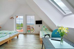 a living room with a couch and a table at Biohof Stotz in Friedrichshafen