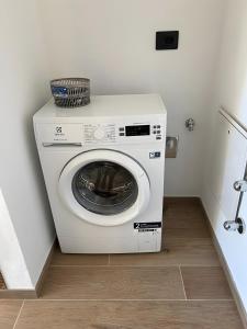 a washing machine in a corner of a room at L’Angolo del Paradiso in Cogne