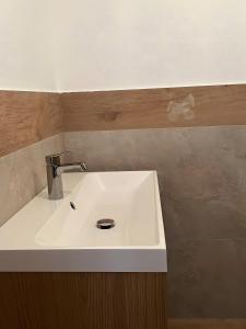 a white sink in a bathroom with at L’Angolo del Paradiso in Cogne