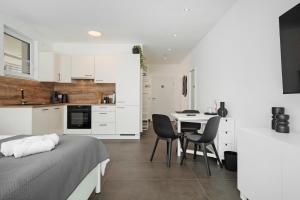a bedroom with a bed and a table and chairs at Apartment Aura in Mengen