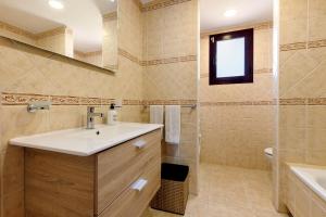 a bathroom with a sink and a shower at Te Mahana Nei House in Costa Calma +20 photos