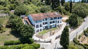 an aerial view of a large white house at Breathing Apartments in Virós