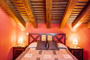 a bedroom with a large bed with two night stands at Casa Alval in Villacastín +33 photos