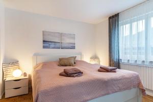 a bedroom with a bed with two pillows on it at Ferienwohnung Schätzle in Schuttertal