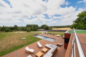 an overhead view of a deck with a swimming pool at Suite Cathédrale - Ty Castel in Ploeren