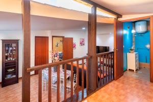 a room with a staircase with blue walls at Villa Ina in Cinisi