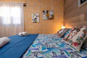 a bed with two towels on top of it at Villa Ina in Cinisi +23 photos