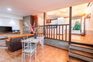 a living room with a table and a couch at Villa Ina in Cinisi