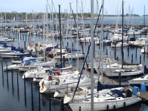 a bunch of boats docked in a harbor at Ferienwohnung Strandperle-Schilksee in Schilksee +3 photos