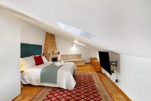 a bedroom with a bed and a television in a room at Carmelo y Carmela 6 in Teror