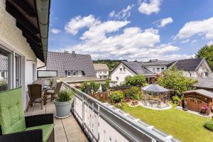a balcony with a view of a yard at Annes Stübchen in Schmallenberg