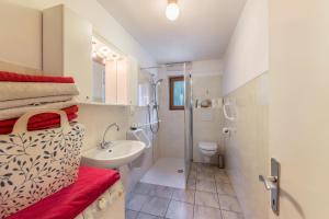 a small bathroom with a sink and a toilet at Ferienwohnung Ainhauser in Campolasta