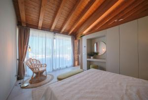a bedroom with a bed and a large window at Ca' Marano Apartments in Centro +47 photos