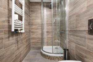 a bathroom with a shower with a toilet and a sink at Haus Schliengen in Schliengen +33 photos