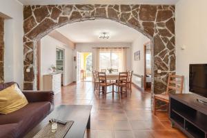 a living room with a couch and a table at Disfruta De La Costa Brava in Lloret de Mar