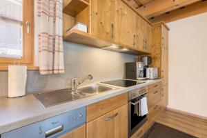 a kitchen with a sink and a stove at Ferienwohnung Stub´n in Freyung