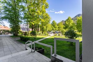 a view of a park with trees and grass at The view 2 in Bad Reichenhall