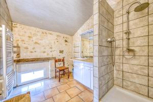 a bathroom with a shower and a sink and a tub at La Grange in Guizengeard +19 photos