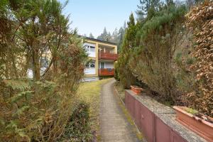 a house with a path leading up to it at Ferienwohnung Dittmar am Kaffeehof in Bad Liebenzell