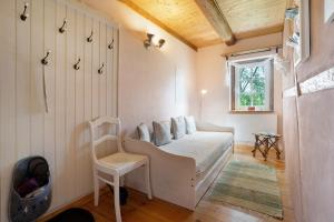 a small living room with a couch and a chair at Ferienwohnung 'Zur Napoleonschanze' in Rathewalde
