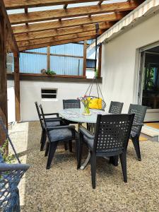a table and chairs on a patio at Muhrbach in Weier