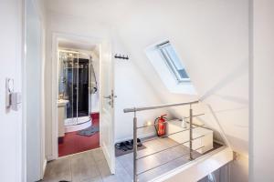 a staircase leading to a bathroom in a house at Haus Falk in Zarpen +16 photos