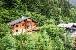 a wooden house on the side of a mountain at La Rissole - Chalet familial in Châtel