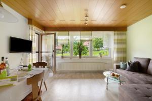 a living room with a couch and a window at Abendrot in Münsingen
