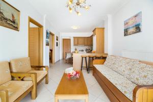 a living room with a couch and a table at Panorama apartment 1 in Póndi