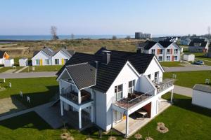 an aerial view of a house with a black roof at Räuberhöhle by Seeblick ferien oro in Kappeln +14 photos