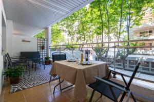 a patio with a table and chairs on a balcony at Apartamentos Salou - 111 in Salou