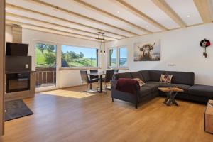 a living room with a couch and a table at Kapellenhof Ferienwohnungen in Triberg