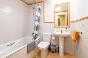 a bathroom with a toilet and a sink and a bath tub at Vista Hermosa in Ayamonte +20 photos