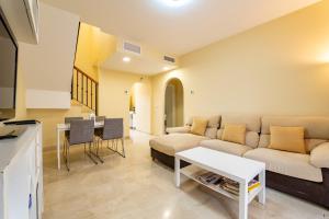 a living room with a couch and a table at Vista Hermosa in Ayamonte