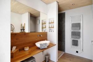 a bathroom with a sink and a mirror at Bodensee Oberschwaben in Horgenzell +21 photos