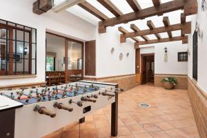 a large game room with a foosball table at Casa Rural Salrima in Alora
