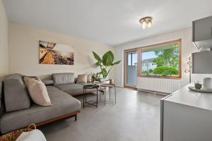 a living room with a couch and a table at Rosenquarz in Überlingen