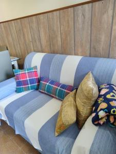 a couch with pillows on it in a room at Nice Lake view apartment in Ispra +32 photos
