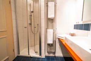 a bathroom with a shower and a sink at Klostermeisterhaus in St. Blasien +102 photos