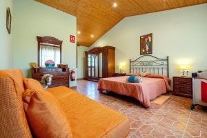 a large bedroom with a bed and a couch at Casa Pont in Tarragona +23 photos