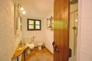 a bathroom with a sink and a toilet at Sestadors in La Puebla +26 photos